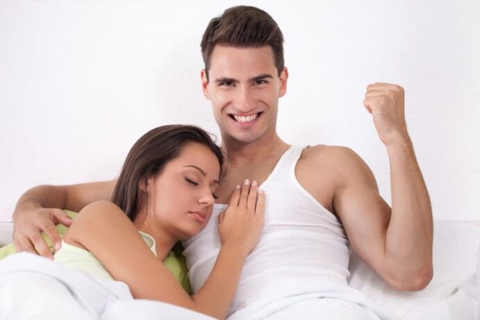 a woman in bed with a man of increased potency