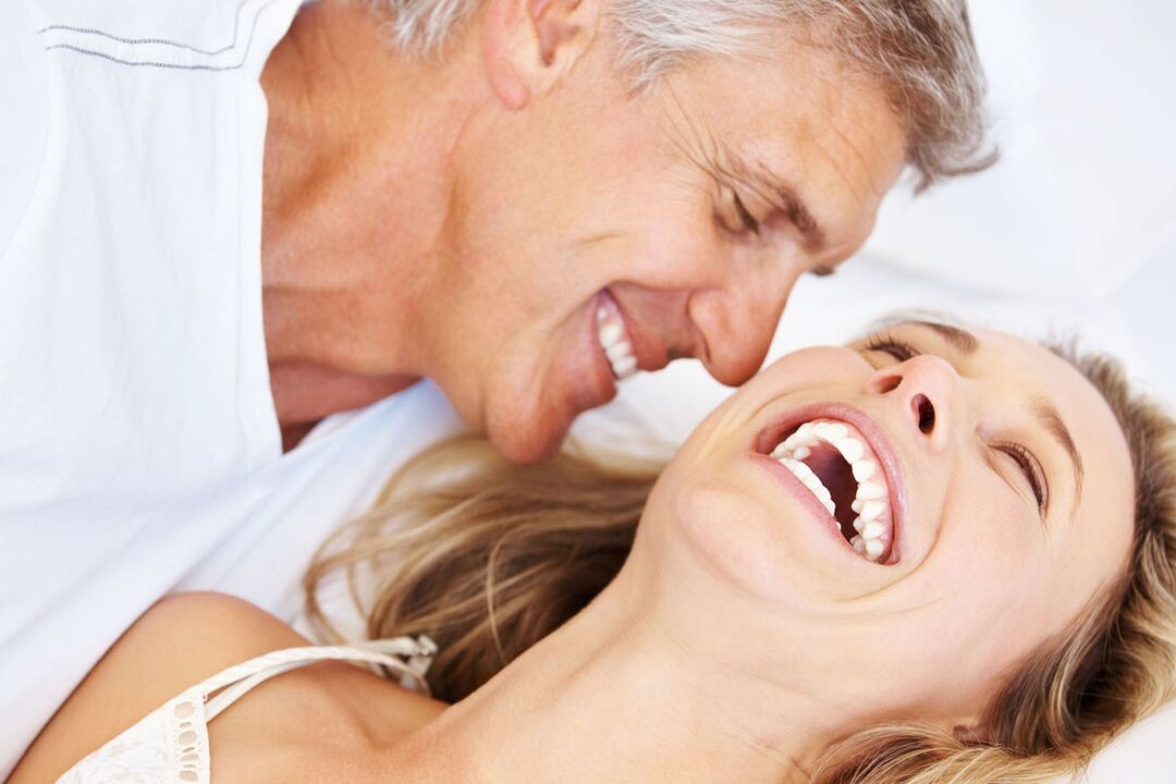 A happy woman with a middle-aged man without problems with potency